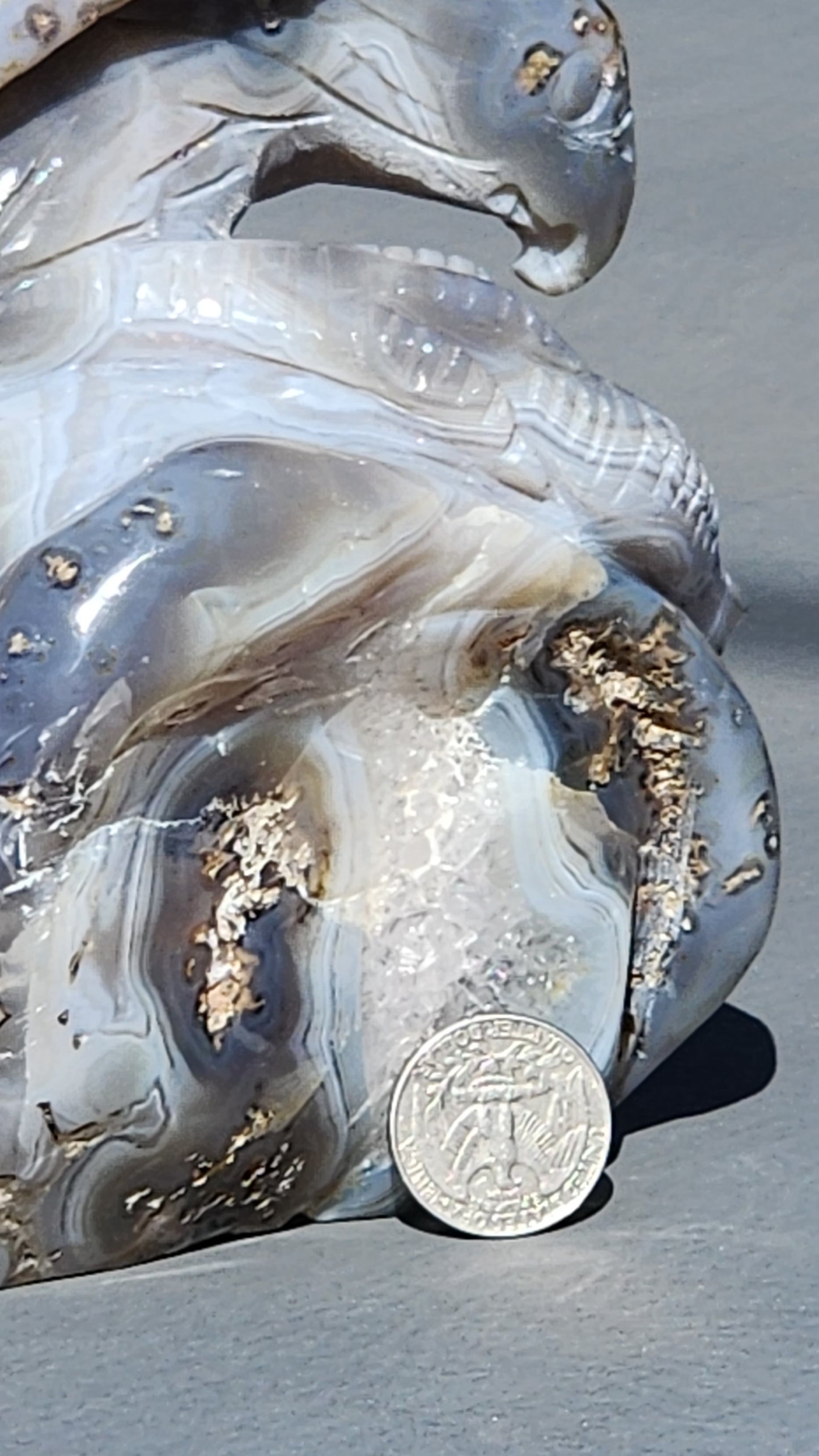 Hand carved eagle with snake on amethyst cluster