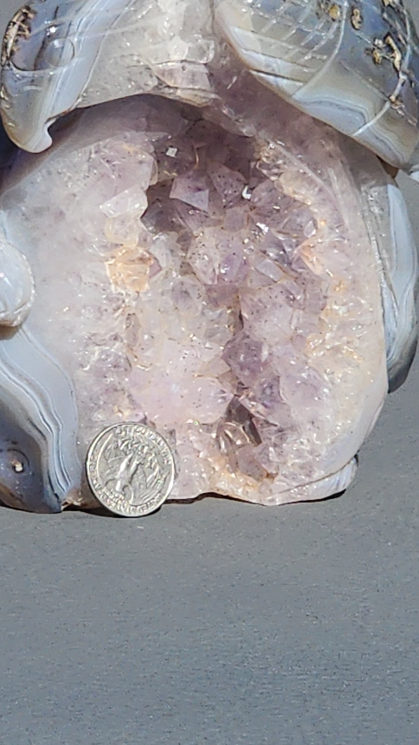 Hand carved eagle with snake on amethyst cluster