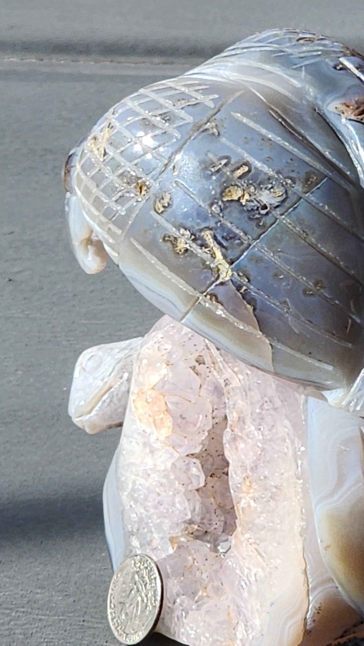 Hand carved eagle with snake on amethyst cluster