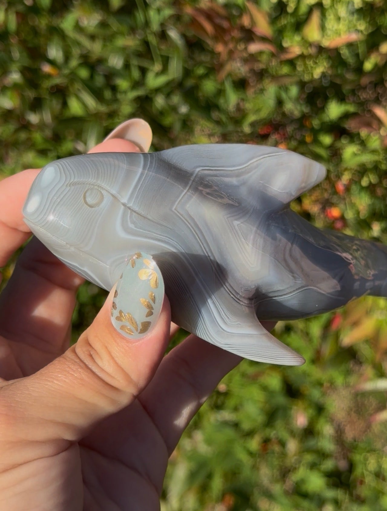 Banded agate whale carving
